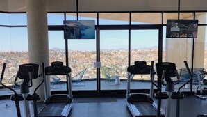 A gym with treadmills, stationary bikes, and elliptical machines. - Loft Style Condo with Stunning View of Tijuana (Tijuana)