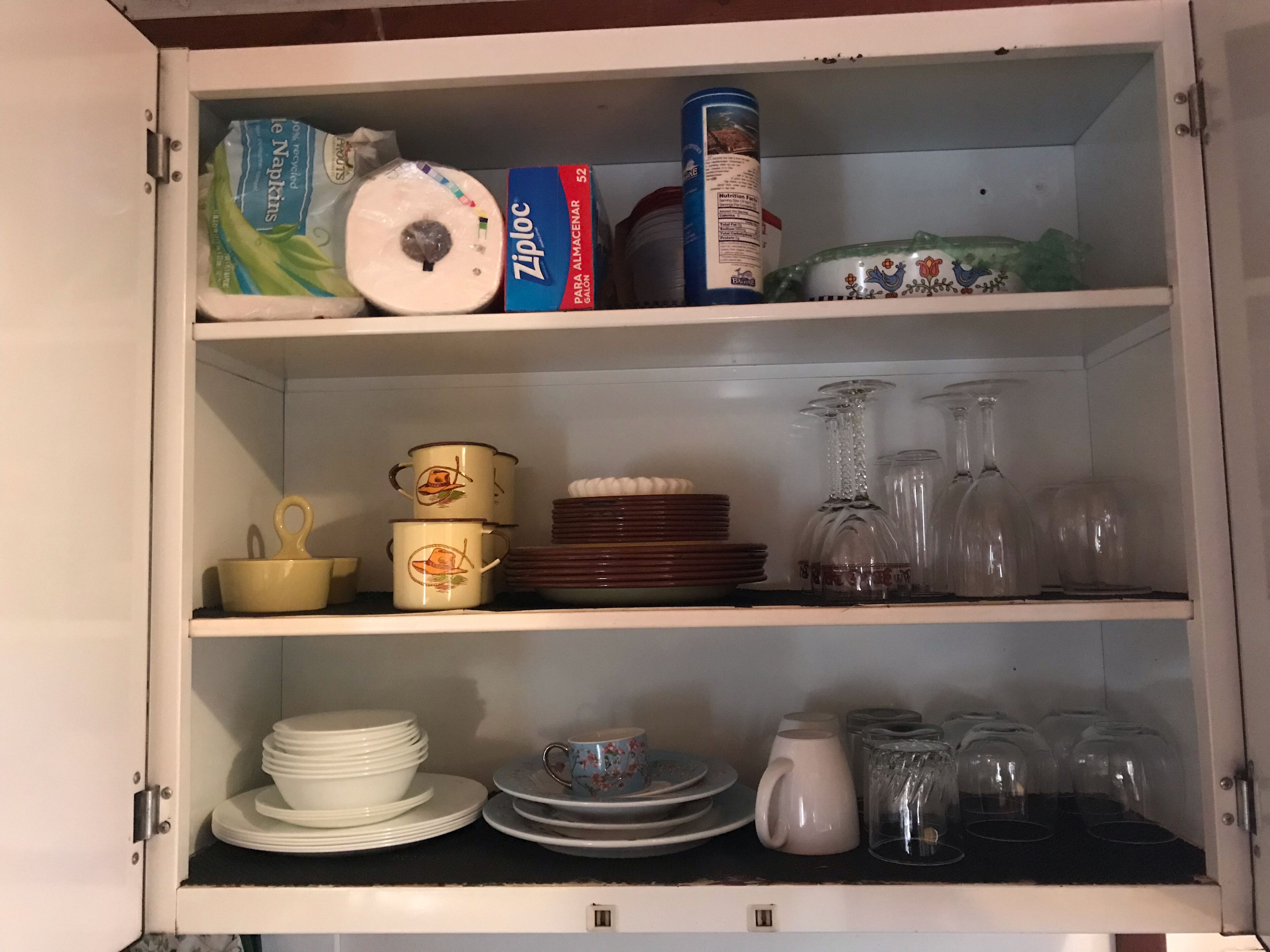 plenty of dishes, cookware and silverware available