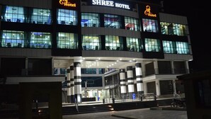 A hotel with a modern design, featuring multiple floors and a prominent entrance with steps. - Shree Hotel (Danta)