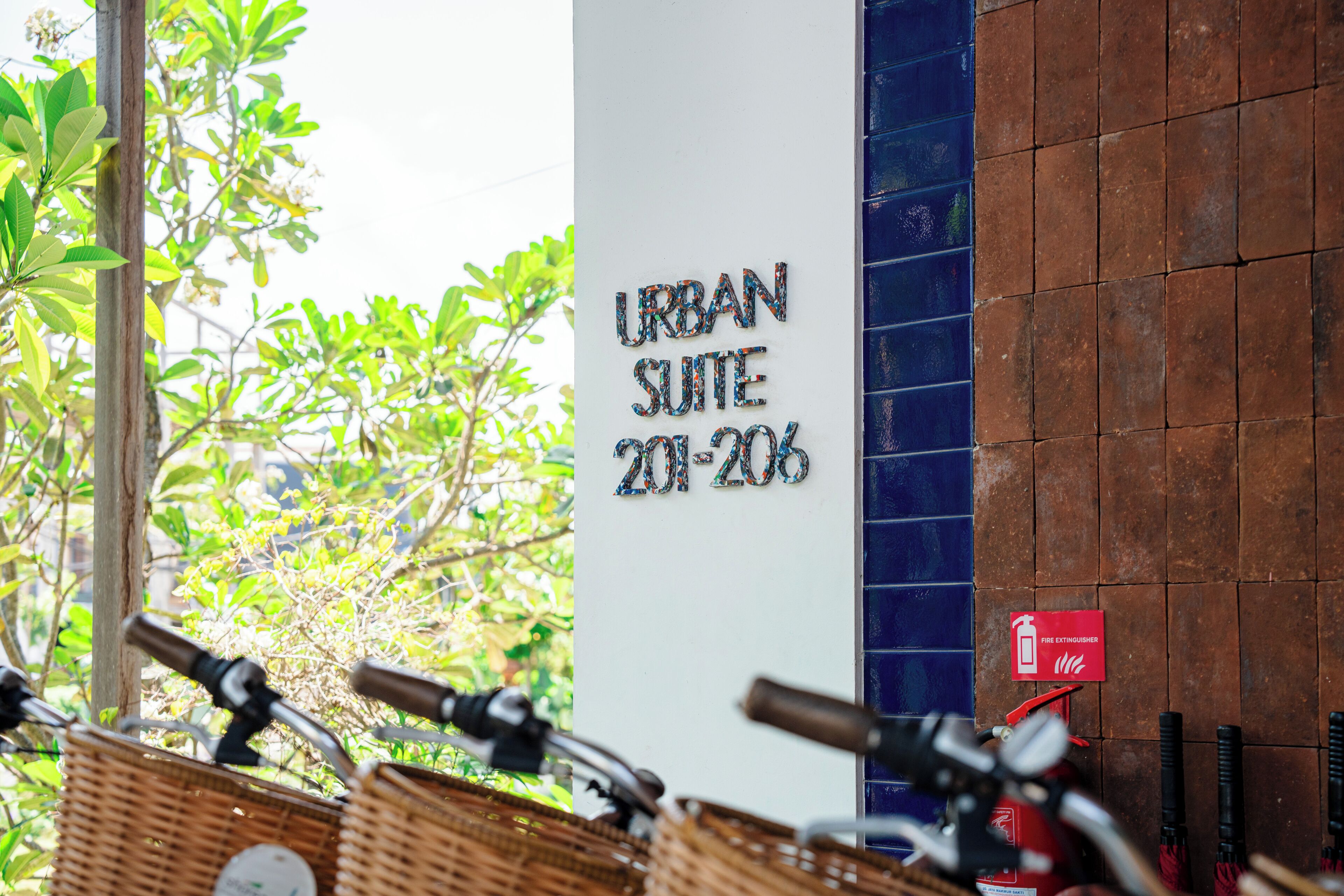 A building entrance with a sign reading 'URBAN SUITE 20-206'.