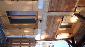A wooden ceiling with skylights and a slatted wooden beam structure. - Chalet adjoining Les Contamines-Montjoie, sleeps 10 (Les Contamines-Montjoie)