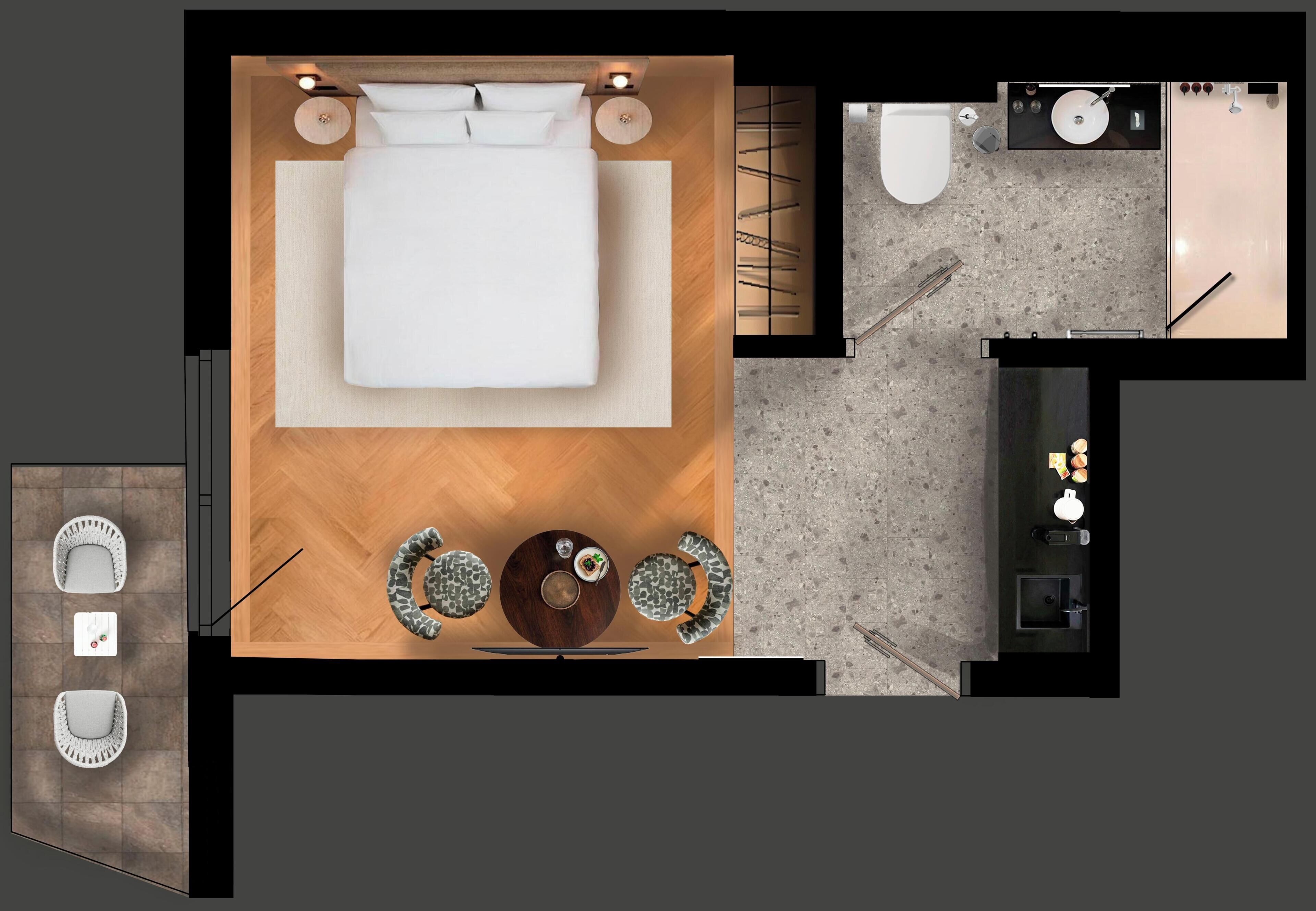 Habitación de hotel con cama, mesitas de noche, un pequeño rincón de descanso, baño con lavamanos e inodoro, y una kitchenette.