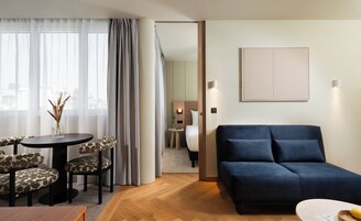 Deluxe Suite, 1 Bedroom | Living area | 42-inch Smart TV with cable channels, streaming services