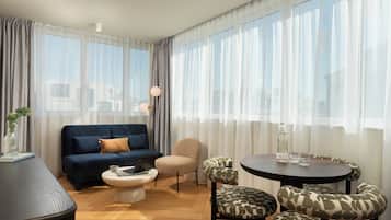 Deluxe Suite, 1 Bedroom | Living area | 42-inch Smart TV with cable channels, streaming services