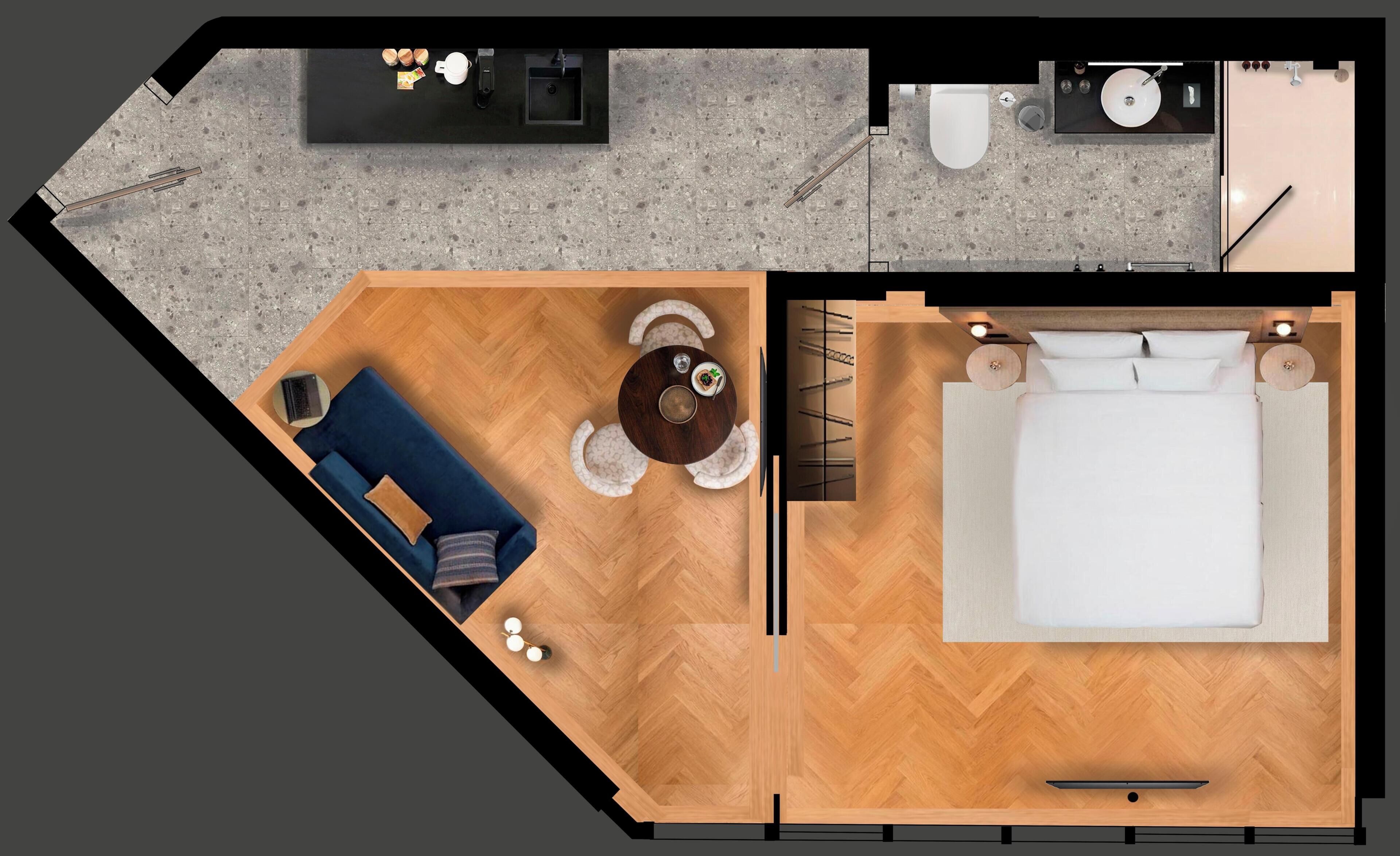 Ett hotellrum med en säng, ett skrivbord, en stol, ett litet bord och en soffa.