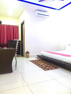 Luxury Room | Premium bedding, desk, laptop workspace, blackout drapes