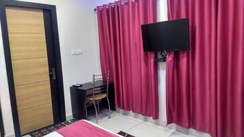 Deluxe Room | Premium bedding, desk, laptop workspace, blackout curtains