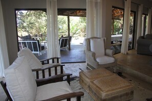 House, 4 Bedrooms | Living area | Flat-screen TV