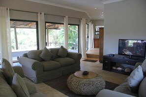 House, 4 Bedrooms | Living area | Flat-screen TV
