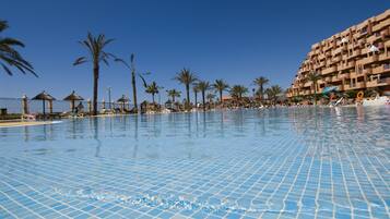 Indoor pool, outdoor pool, pool umbrellas, pool loungers