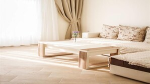 Appartement Confort, vue sur la mer | Aire de séjour