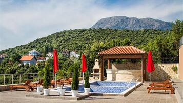 Outdoor pool, pool umbrellas, pool loungers