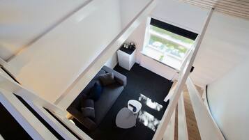 Deluxe Room, Refrigerator | Living area | TV