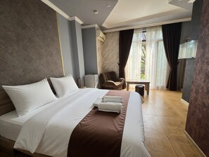 Suite Studio Classique | Literie de qualité supérieure, minibar, décoration personnalisée