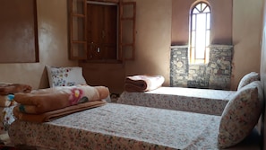 Traditional Triple Room, 3 Twin Beds, Private Bathroom | Blackout drapes, cribs/infant beds, free WiFi, bed sheets