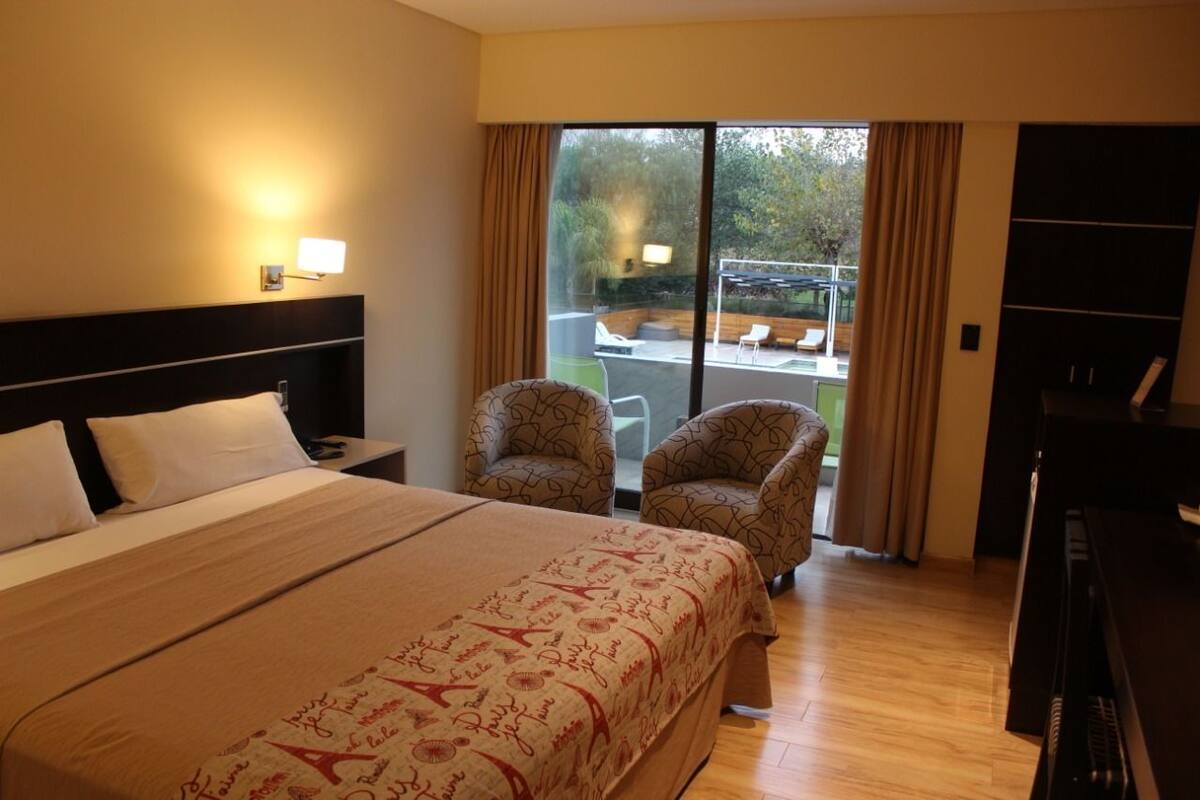 Standard Double Room | Minibar (some free items), in-room safe, blackout drapes