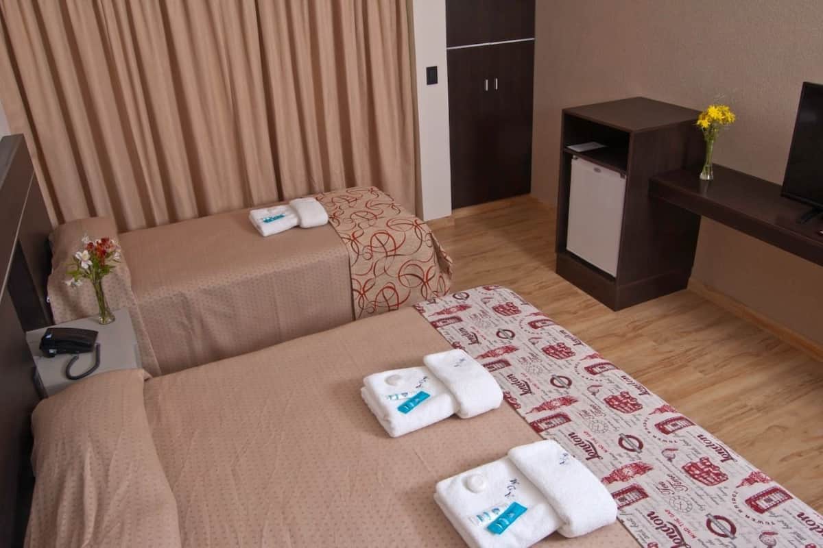 Standard Triple Room | Minibar (some free items), in-room safe, blackout drapes