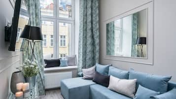 Leilighet – deluxe | Oppholdsrom | Flatskjerm-TV