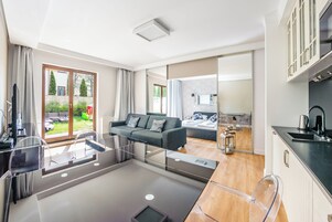 Apartment (C4) | Private kitchen | Fridge, stovetop, electric kettle, highchair