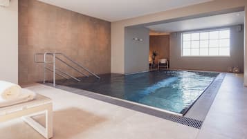 Relax by the pool, surrounded by a clean and contemporary design.