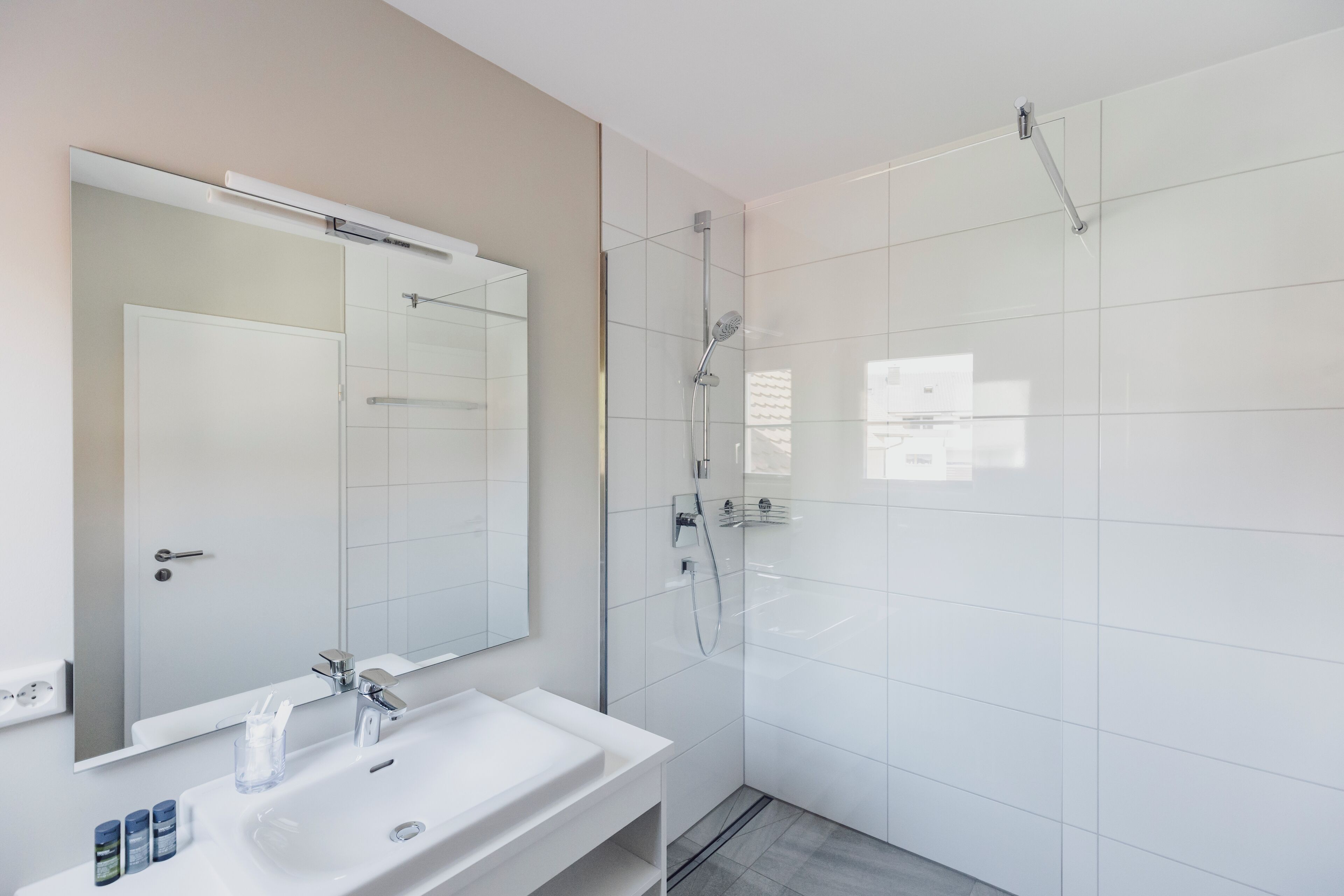 shower, bathrobes, slippers, towels