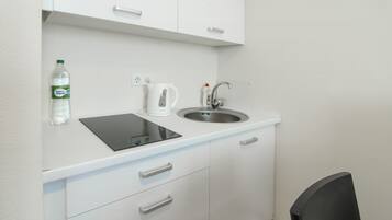 Espresso maker, full-sized fridge, microwave, stovetop