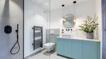 Bathtub, hair dryer, towels, soap