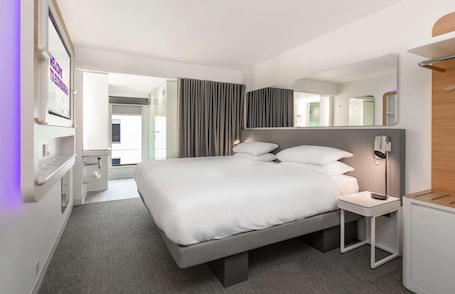 Premium bedding, memory foam beds, in-room safe, blackout drapes. YOTEL Edinburgh