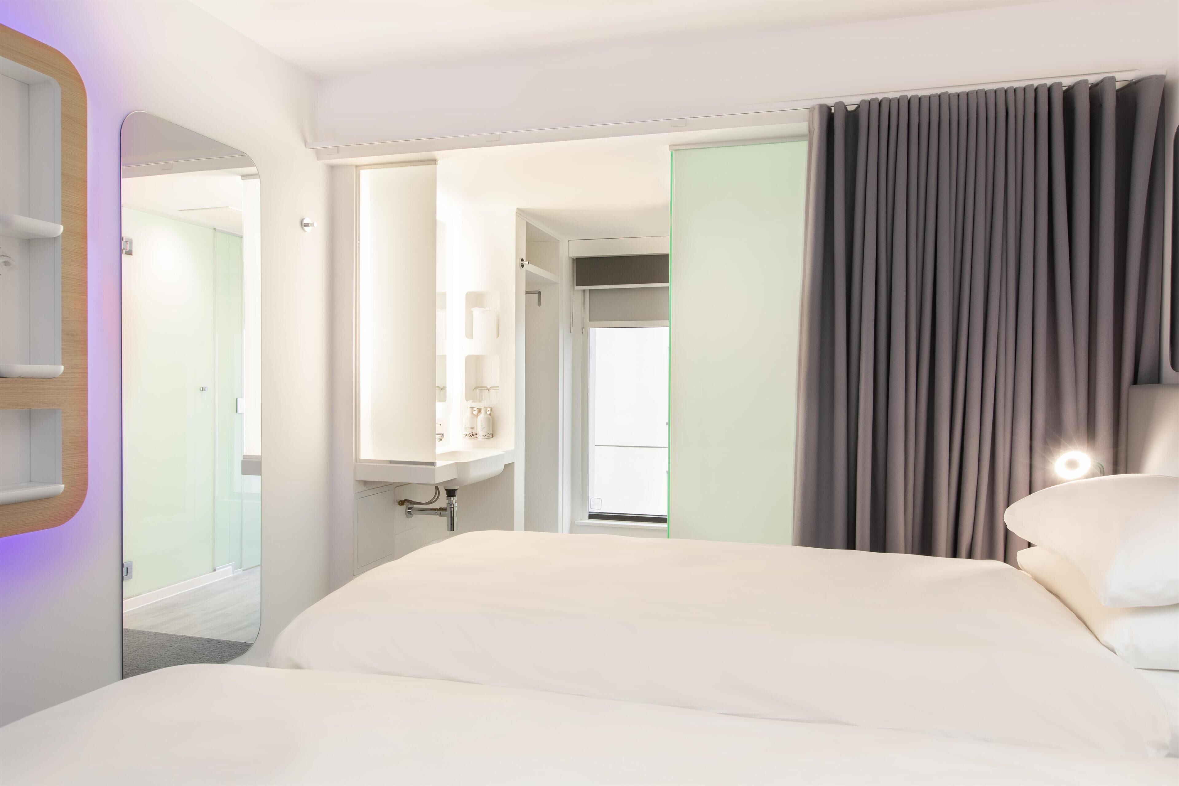 Premium bedding, memory-foam beds, in-room safe, blackout curtains