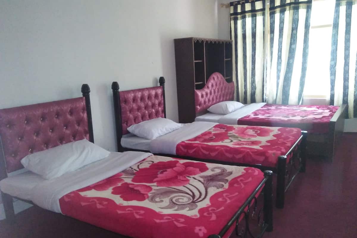 Economy Quadruple Room, Garden View | Memory foam beds, iron/ironing board, rollaway beds, free WiFi