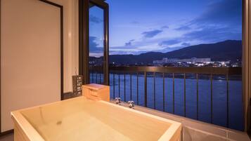 Japanese Western Style Room with Semi Open-air Bath, River view | Bathroom | Bathtub, hair dryer, slippers, towels