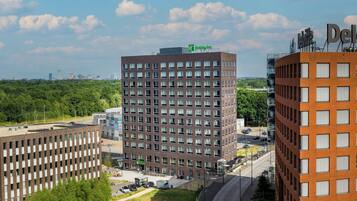 A Holiday Inn Express building with a brick facade, multiple windows, and a flat roof.