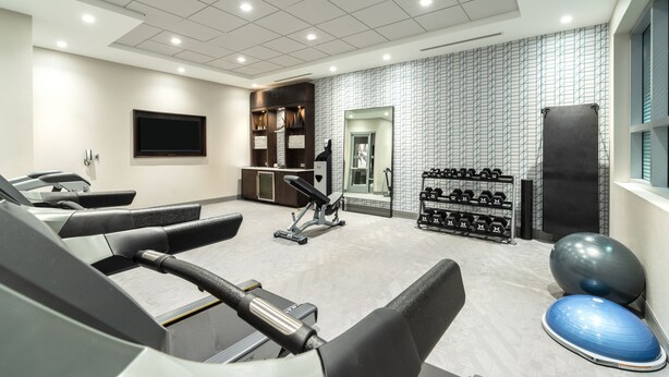 A gym with treadmills, exercise balls, and dumbbells. - Holiday Inn Express Boston South - Quincy by IHG (Quincy)