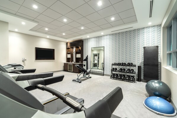 A gym with treadmills, exercise balls, and dumbbells. - Holiday Inn Express Boston South - Quincy by IHG (Quincy)