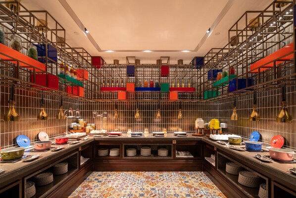 A well-organized buffet area with multiple serving stations, a variety of dishes, and neatly arranged serving ware. - Hotel Indigo Heilong Lake by IHG (Meishan)