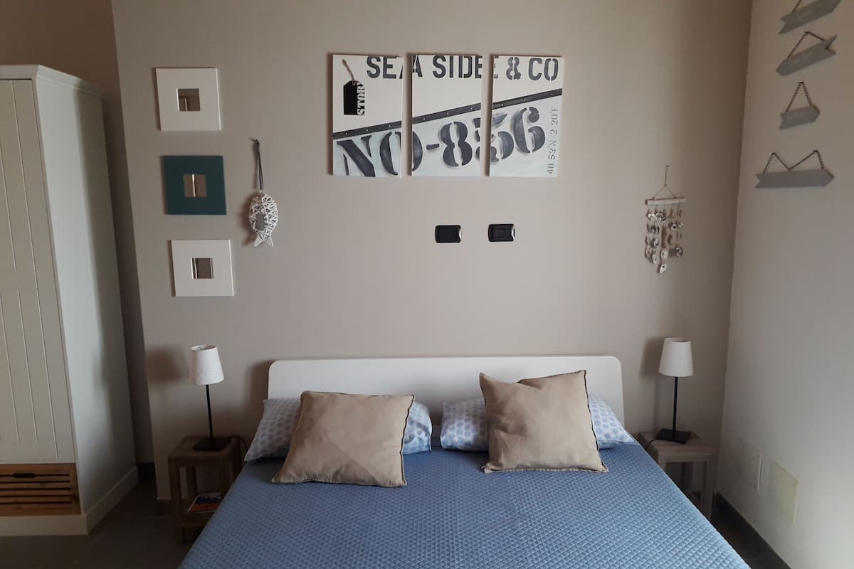 Habitación ejecutiva, vista parcial al mar | Ropa de cama de alta calidad y decoración personalizada