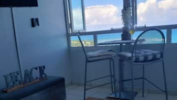 Apartment, Sea View | Living area | TV