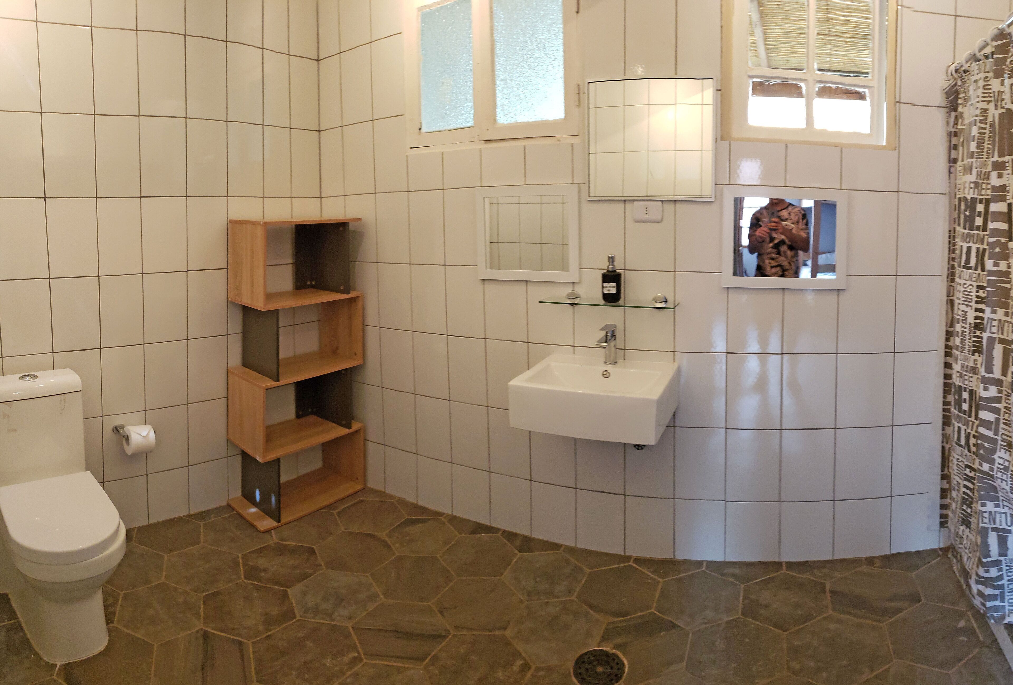 family room | bathroom | combined shower/bathtub, rainfall showerhead, free toiletries, bathrobes