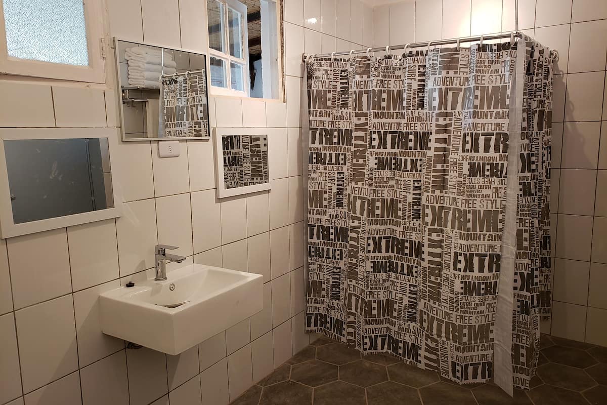 family room | bathroom | combined shower/bathtub, rainfall showerhead, free toiletries, bathrobes