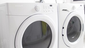 Two white front-loading washing machines in a clean, tiled room. - NEW DESIGN DUPLEX - BOGO64 303 (Bogotá)
