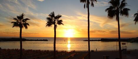 On the beach, sun-loungers, beach umbrellas