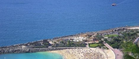 On the beach, sun-loungers, beach umbrellas