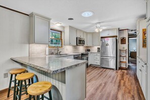 Fridge, microwave, oven, stovetop - Cairns Home-Waterfront, family-friendly, wide water views (Moneta)