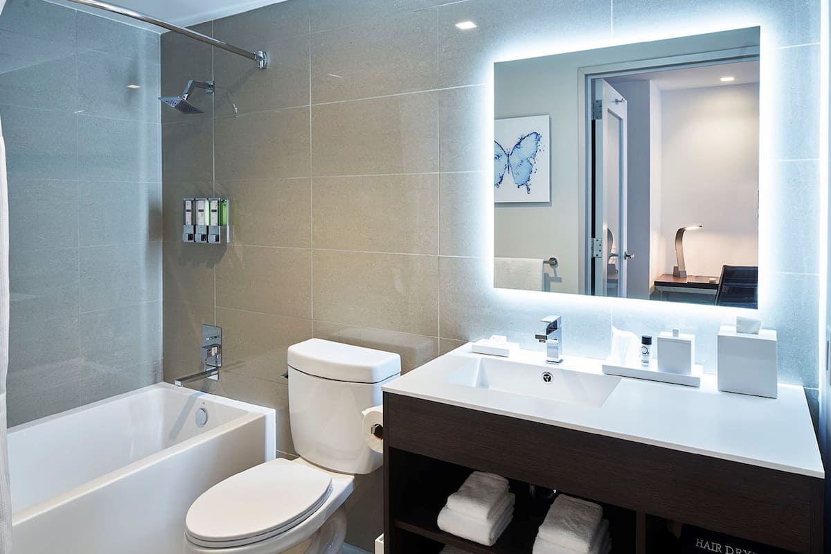 combined shower/bathtub, hair dryer, bathrobes, towels