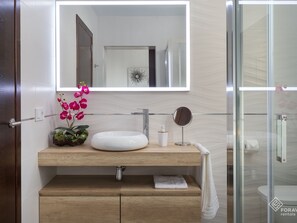 Shower, hair dryer, bathrobes, towels