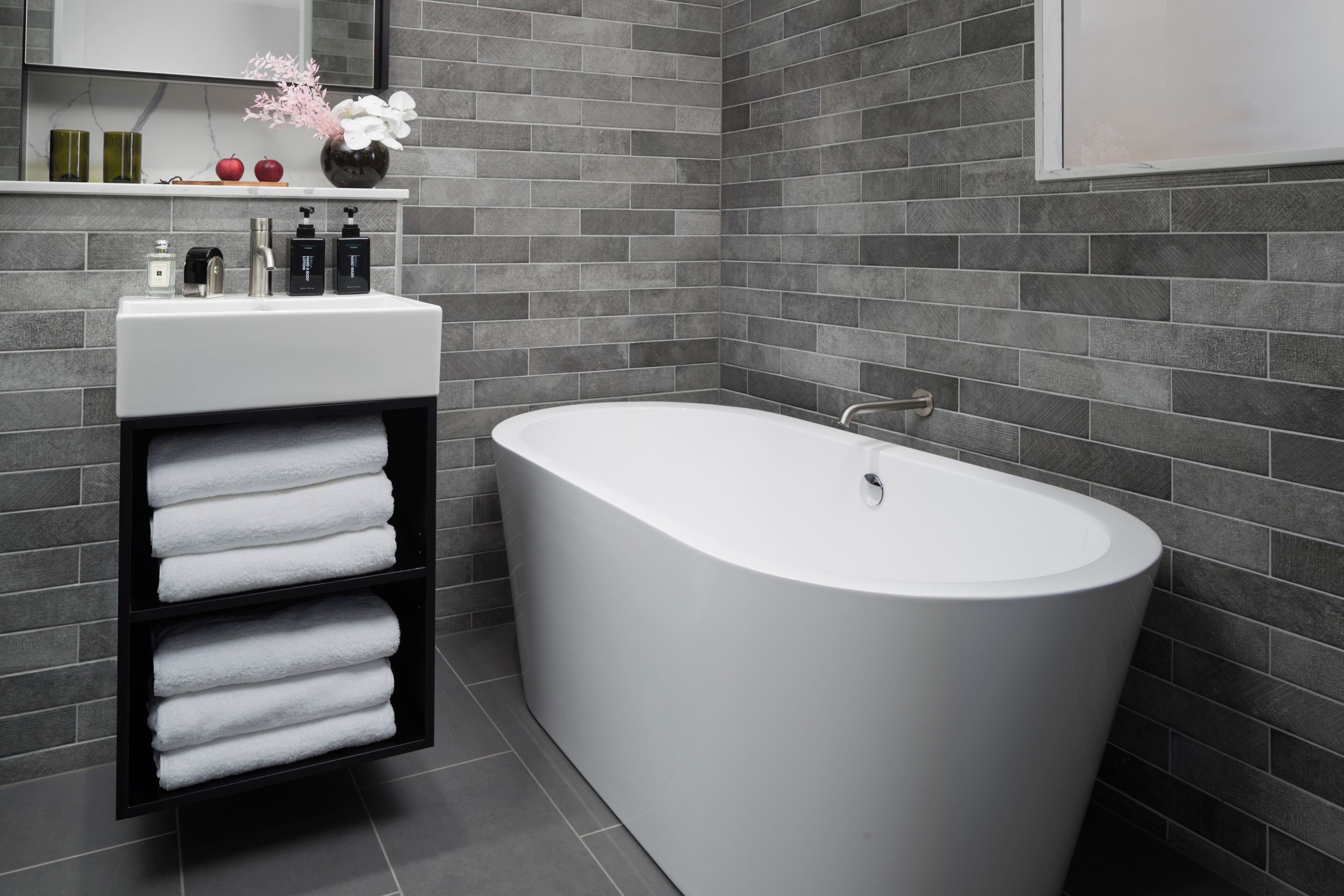 urban master bath | bathroom | eco-friendly toiletries, hair dryer, bathrobes, towels
