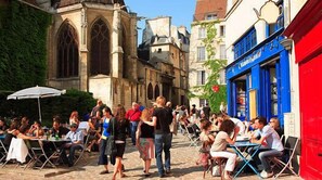 Outdoor dining - Marais Market Street Gem | Chic 1BR + Sofa Bed (Paris)