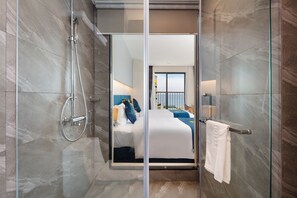 Deluxe Room, Balcony, Sea View | Minibar, in-room safe, desk, free WiFi