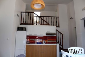 Fridge, microwave, stovetop, coffee/tea maker
