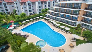 Seasonal outdoor pool, open 9:00 AM to 6:00 PM, pool umbrellas